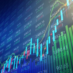 Foto de um painel de investimentos com diversos gráficos coloridos.